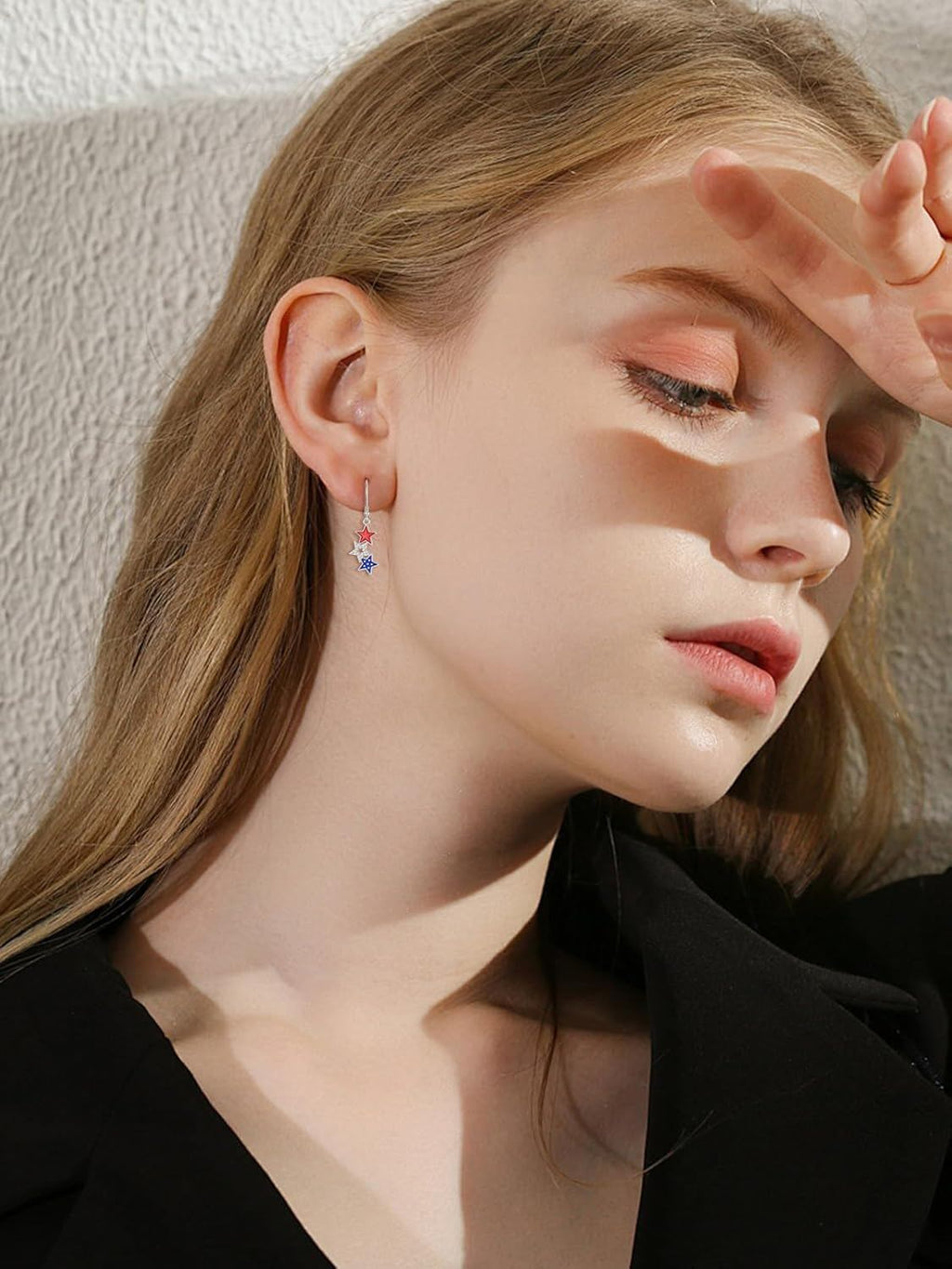 Model wearing sterling silver patriotic star dangle earrings lifestyle view