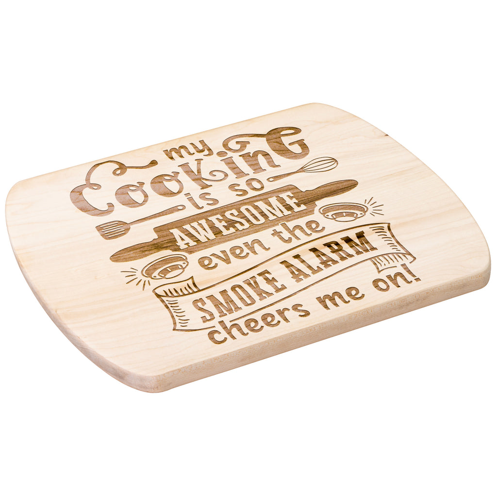 An oval maple wood cutting board with a humorous quote about smoke alarms.