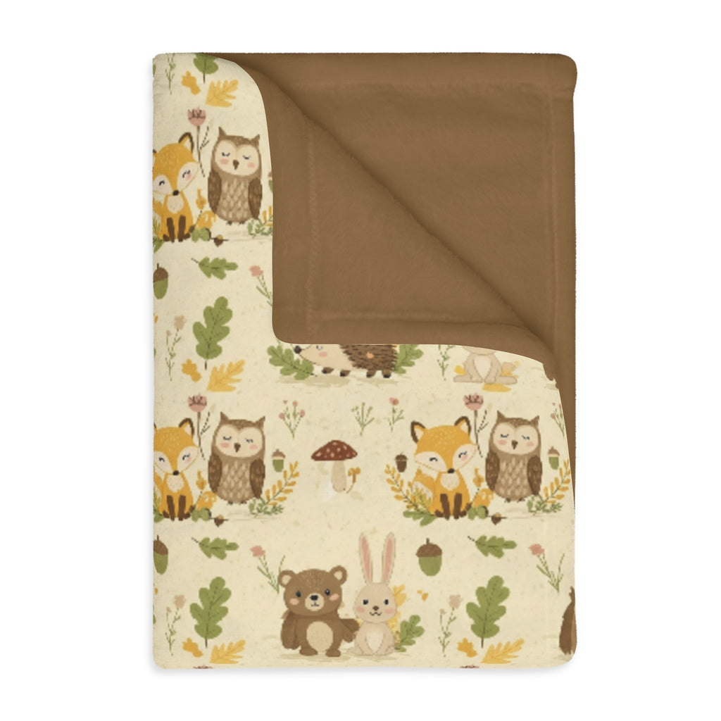 Cream woodland baby blanket folded