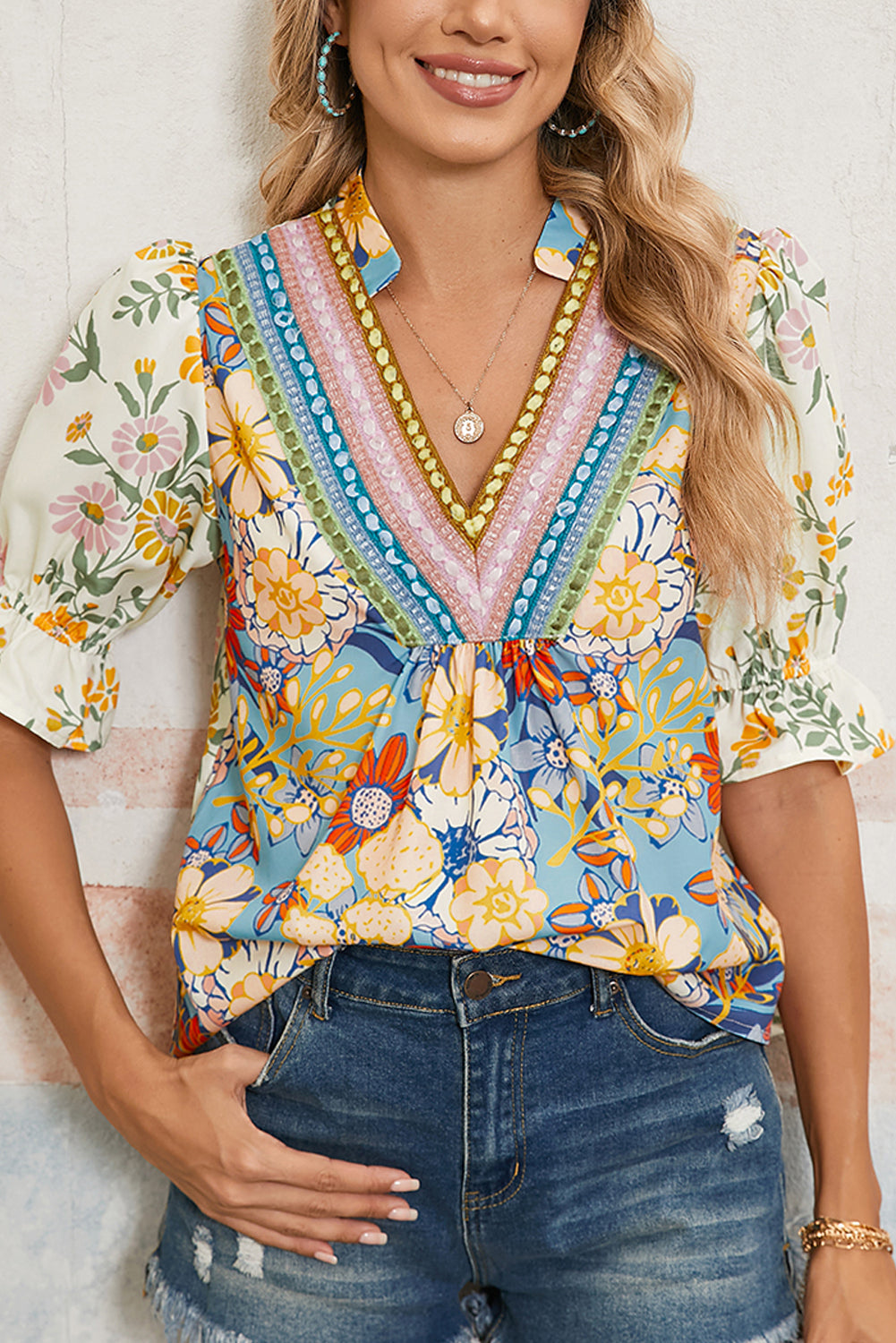 Boho Floral Blouse with Crochet V-Neck and puff sleeves worn with denim shorts