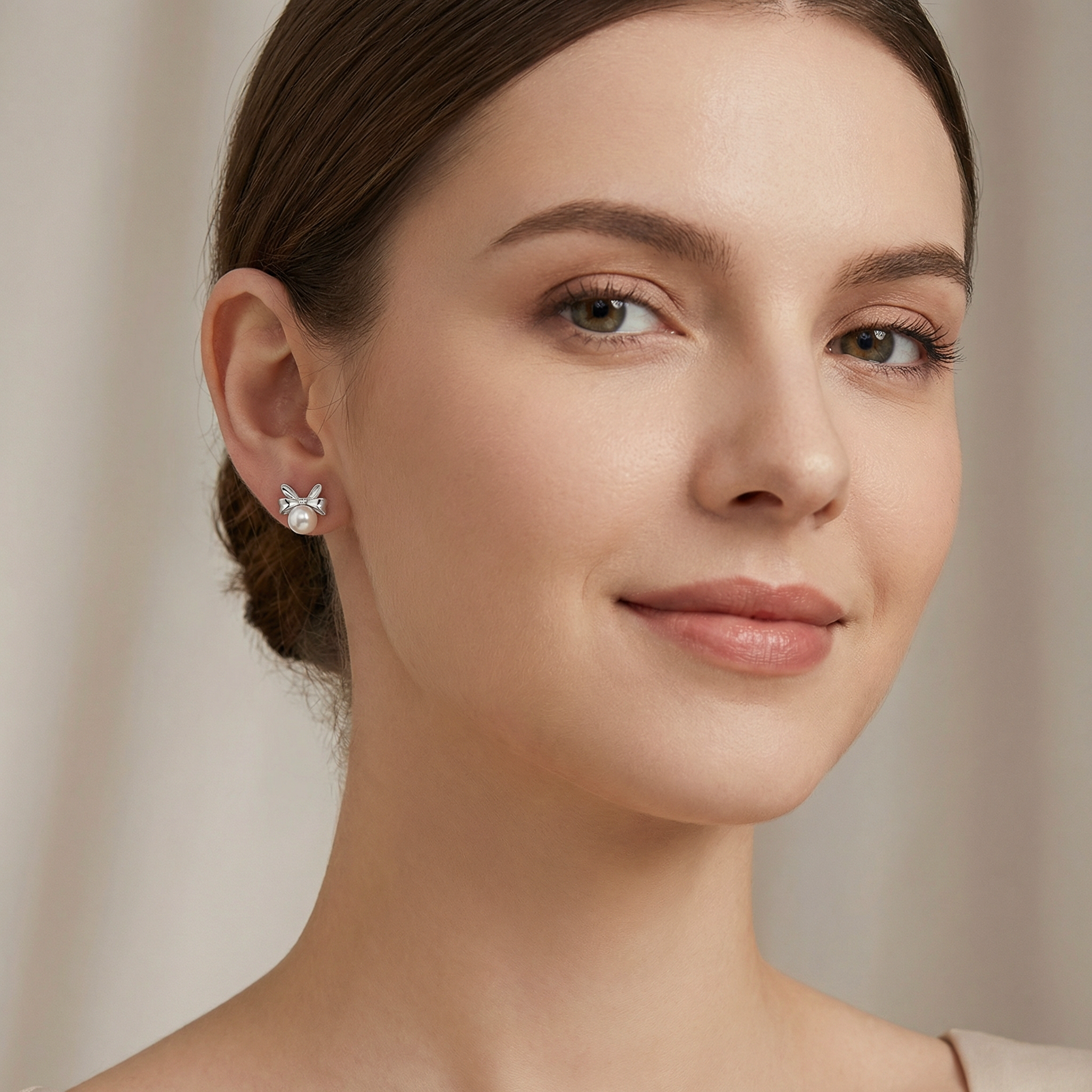 Model wearing Sterling Silver Bow Knot Pearl Stud Earrings