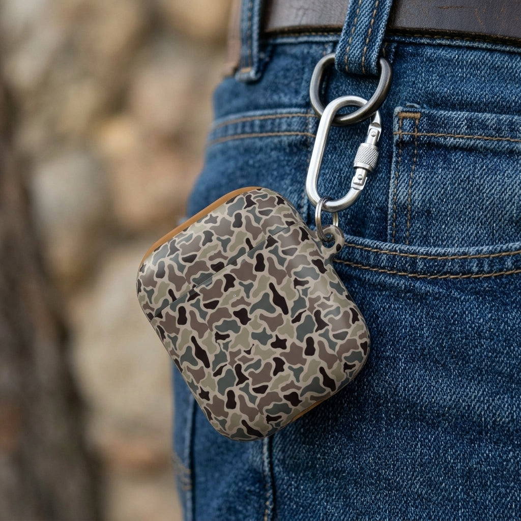 Close-up of standard style duck camo AirPods case with carabiner attached to a belt loop